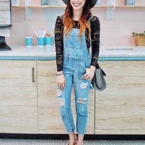 Distressed light wash overalls